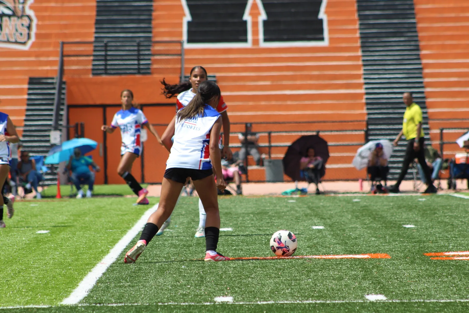 A player winds up to strike the ball during the U17 match.