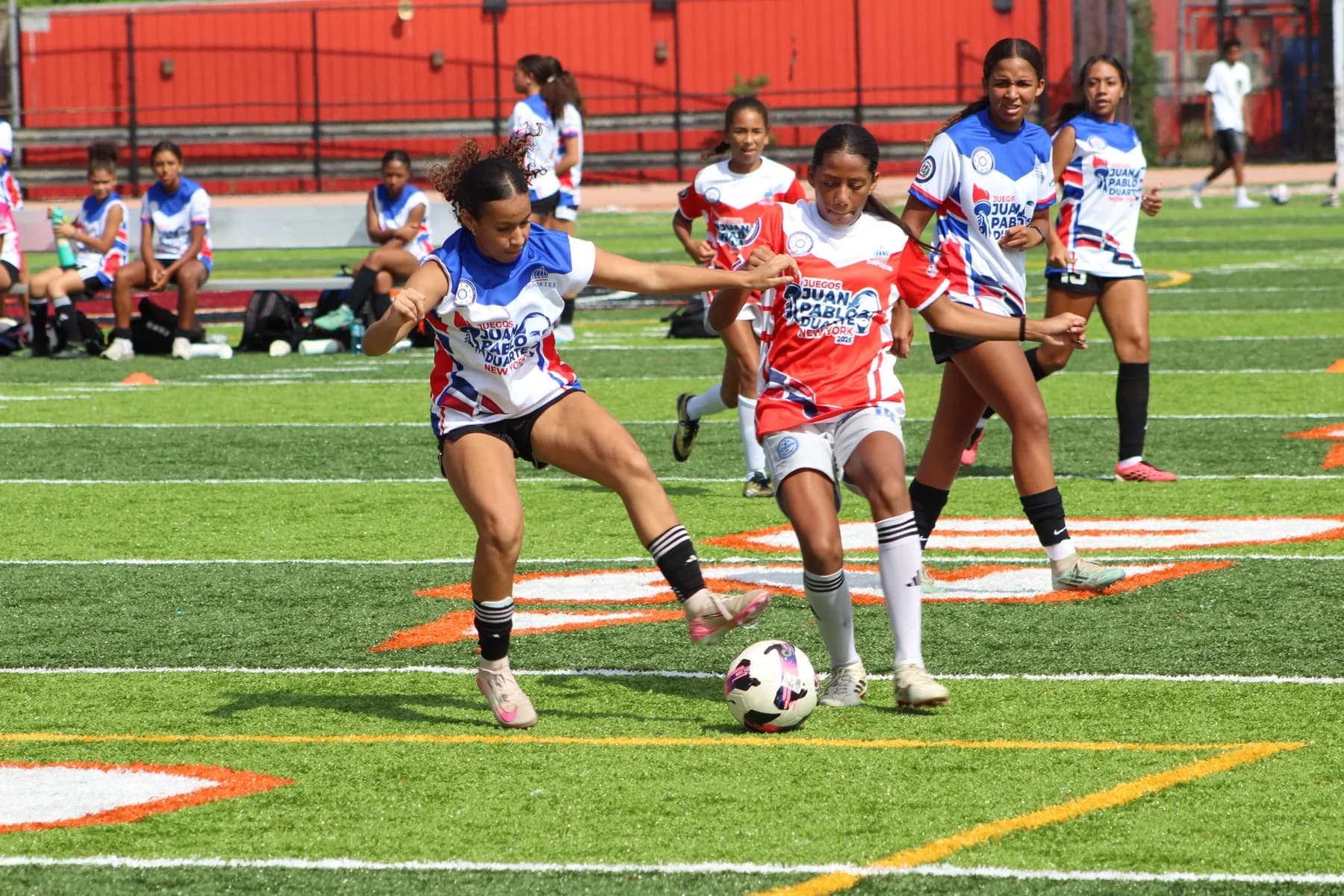 Dominican-American girls competing for the ball at the Juegos Juan Pablo Duarte showcase in Manhattan.